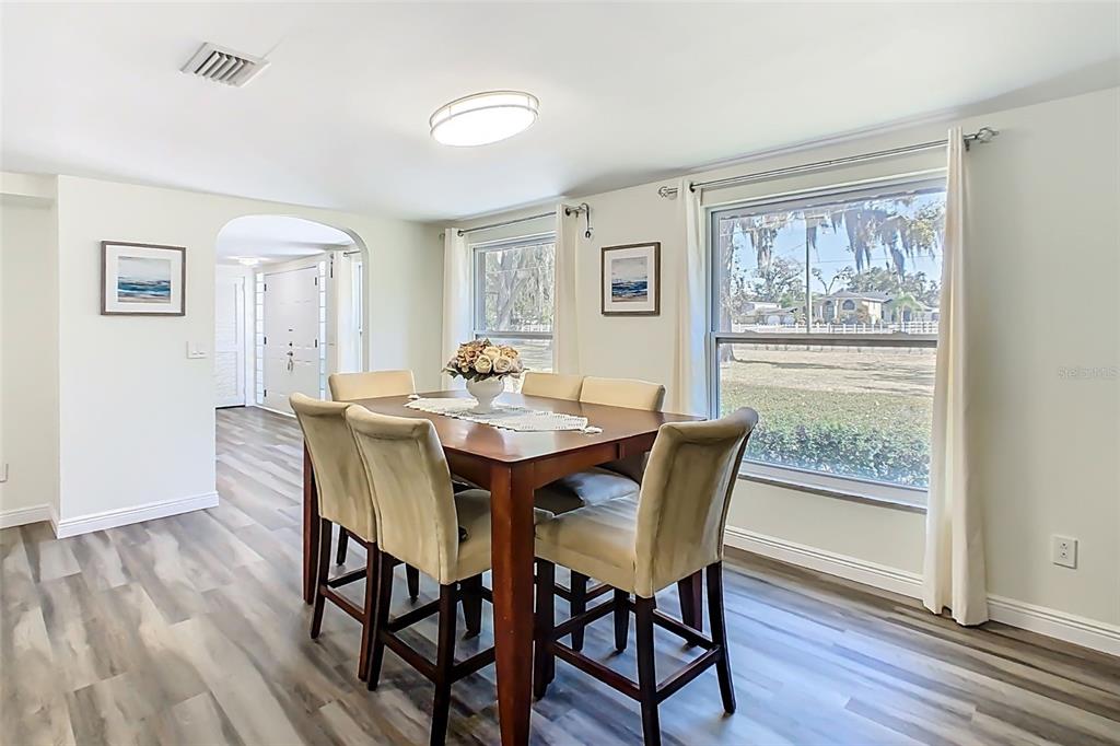 1700 South Miller Road Valrico, FL 33594 - Photo 15 of 53 a view of a dining room with furniture window and wooden floor