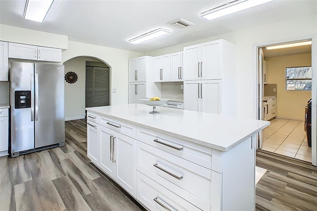 1700 South Miller Road Valrico, FL 33594 - Photo 19 of 53 a kitchen with kitchen island a stove a refrigerator and a cabinets