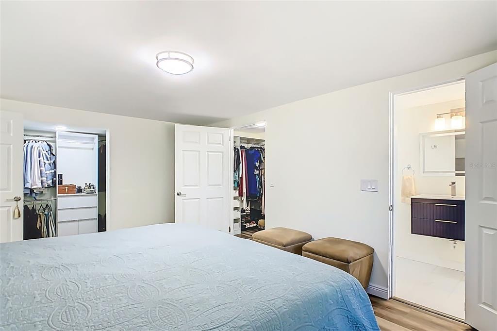 1700 South Miller Road Valrico, FL 33594 - Photo 21 of 53 a bedroom with a bed and a mirror