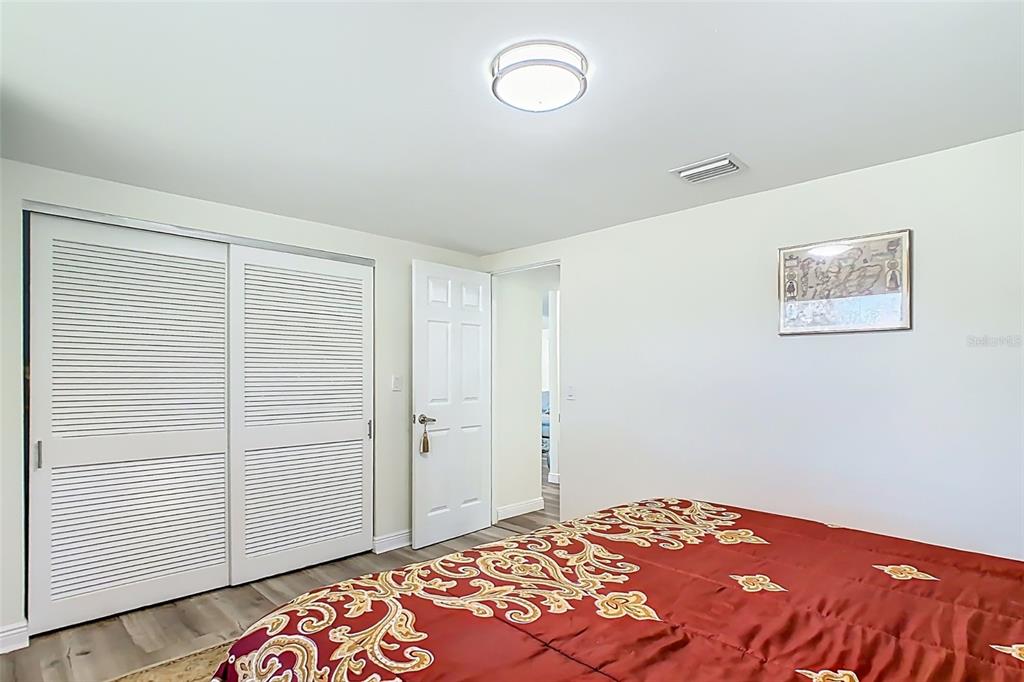 1700 South Miller Road Valrico, FL 33594 - Photo 25 of 53 a bedroom with a bed and a painting on the wall