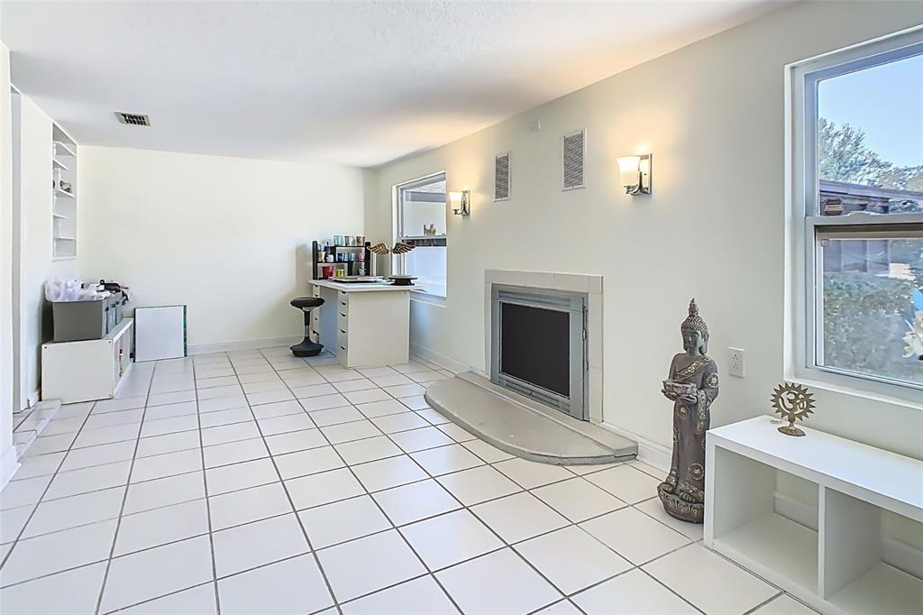1700 South Miller Road Valrico, FL 33594 - Photo 31 of 53 a room with a washing machine and a fireplace