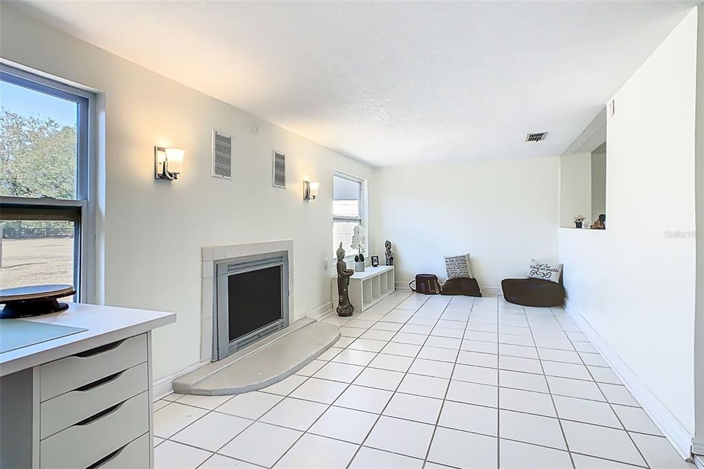 1700 South Miller Road Valrico, FL 33594 - Photo 32 of 53 a view of an empty room with a fireplace and a window