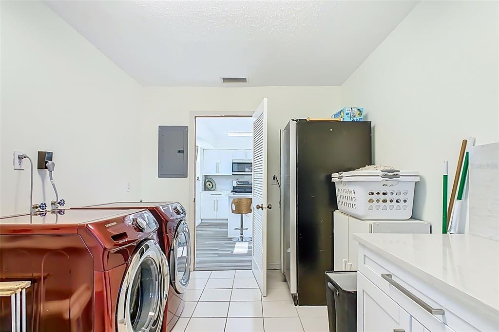 1700 South Miller Road Valrico, FL 33594 - Photo 35 of 53 a utility room with refrigerator and washer
