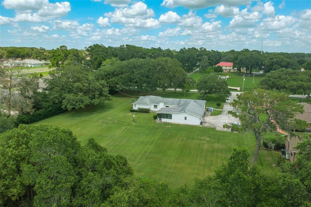 1700 South Miller Road Valrico, FL 33594 - Photo 40 of 53 a aerial view of a house with pool yard and outdoor seating