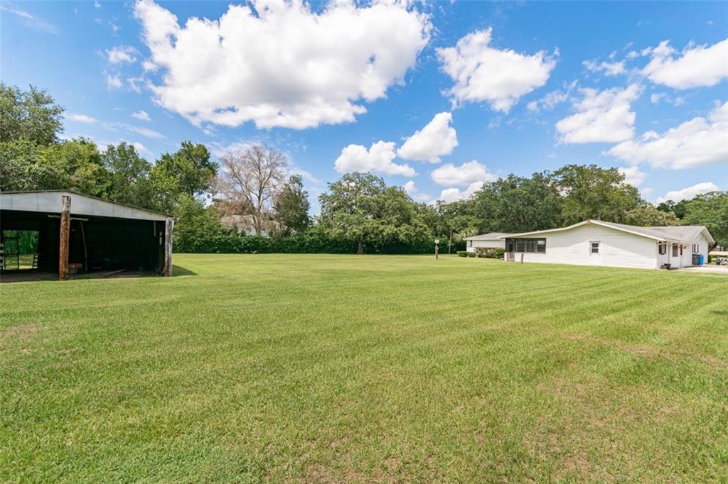 1700 South Miller Road Valrico, FL 33594 - Photo 42 of 53 a view of a house with a yard