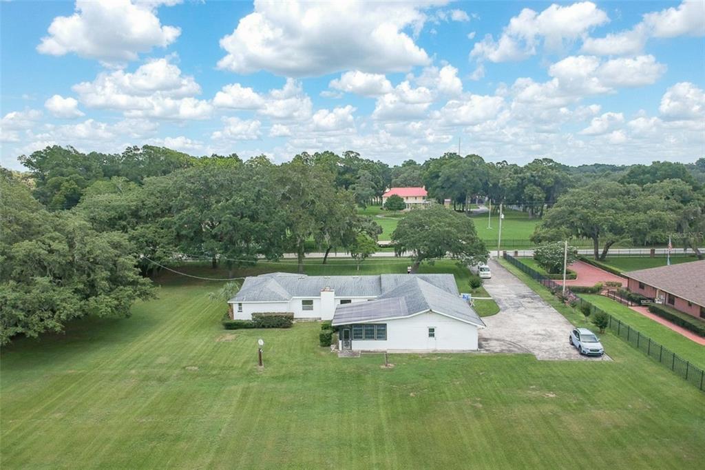 1700 South Miller Road Valrico, FL 33594 - Photo 46 of 53 a aerial view of a house with swimming pool garden and mountains