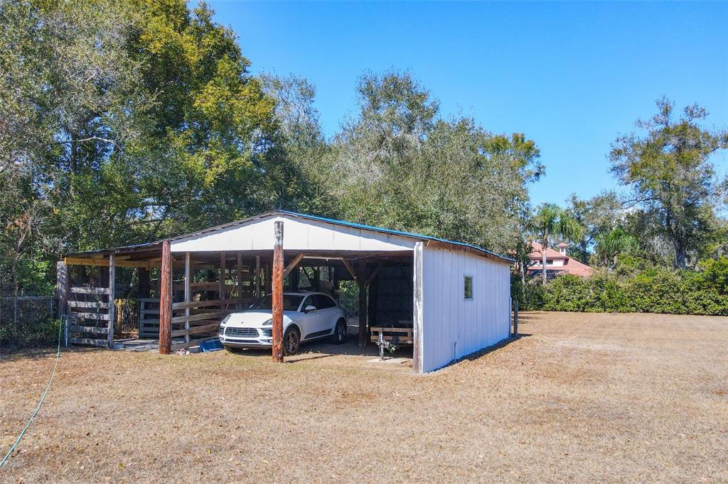 1700 South Miller Road Valrico, FL 33594 - Photo 49 of 53 a view of a patio with furniture and a yard