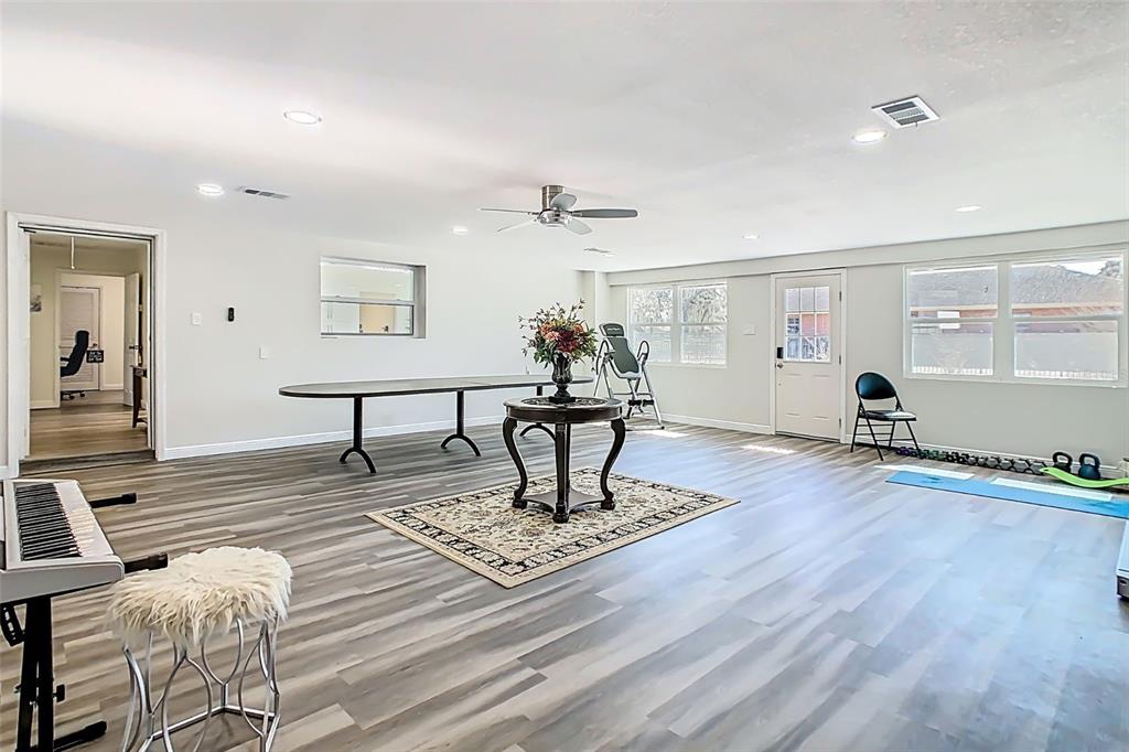 1700 South Miller Road Valrico, FL 33594 - Photo 7 of 53 a living room with furniture and a chandelier