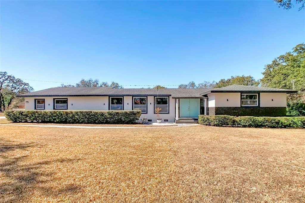 1700 South Miller Road Valrico, FL 33594 - Photo 10 of 53 a front view of a house with a yard