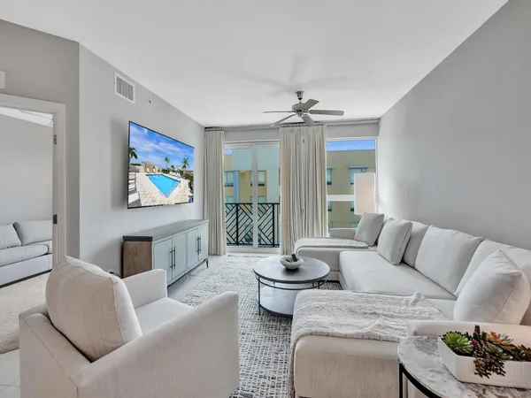 a living room with furniture and a table