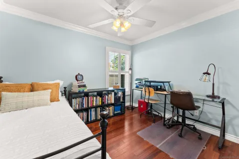 a bedroom with furniture and a window