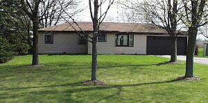 6838 Tipple Road Rockford, IL 61102 - Photo 1 of 6 a view of a house with a yard and tree s