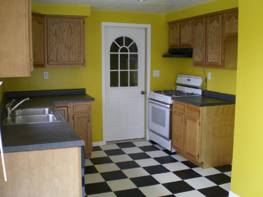 6838 Tipple Road Rockford, IL 61102 - Photo 2 of 6 a kitchen with a stove a sink and a refrigerator