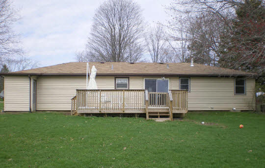 6838 Tipple Road Rockford, IL 61102 - Photo 6 of 6 a view of a house with a backyard