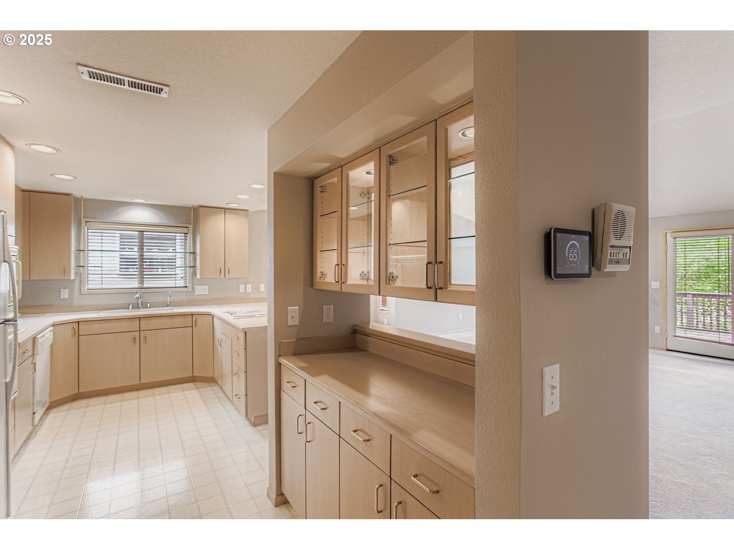 15917 Northeast Union Road, Unit 113 Ridgefield, WA 98642 - Photo 11 of 27 a kitchen with a refrigerator and a sink