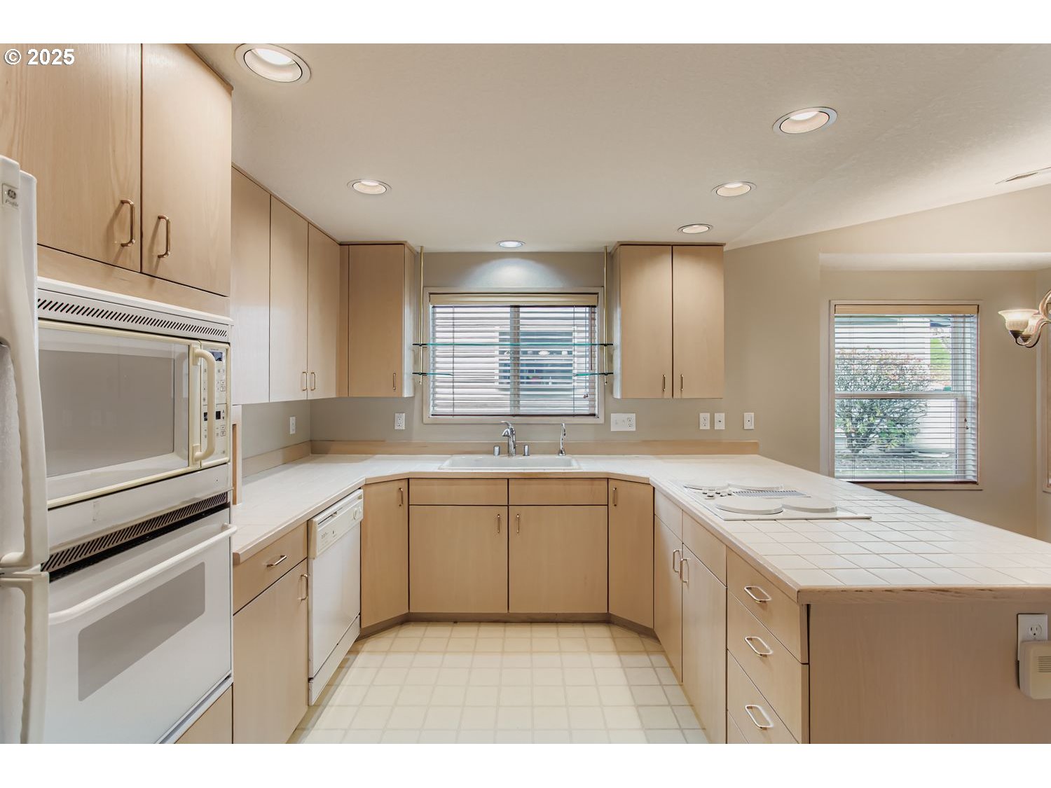 15917 Northeast Union Road, Unit 113 Ridgefield, WA 98642 - Photo 12 of 27 a kitchen with a sink stove and cabinets