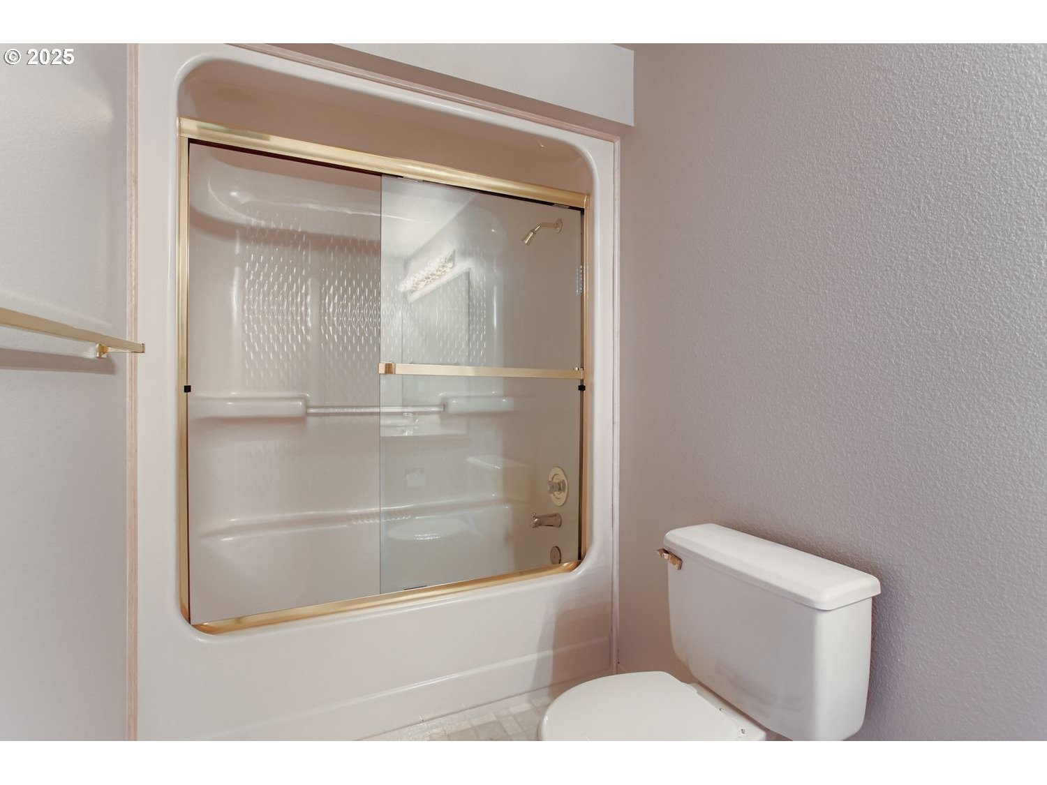 15917 Northeast Union Road, Unit 113 Ridgefield, WA 98642 - Photo 21 of 27 a bathroom with a glass shower door