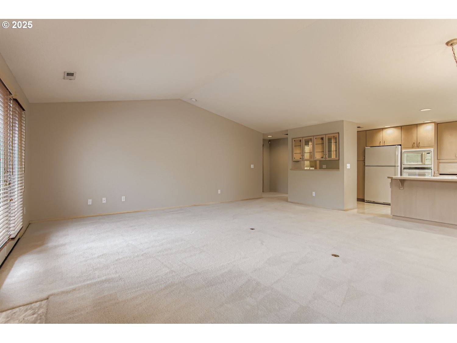15917 Northeast Union Road, Unit 113 Ridgefield, WA 98642 - Photo 6 of 27 a view of an empty room with a kitchen