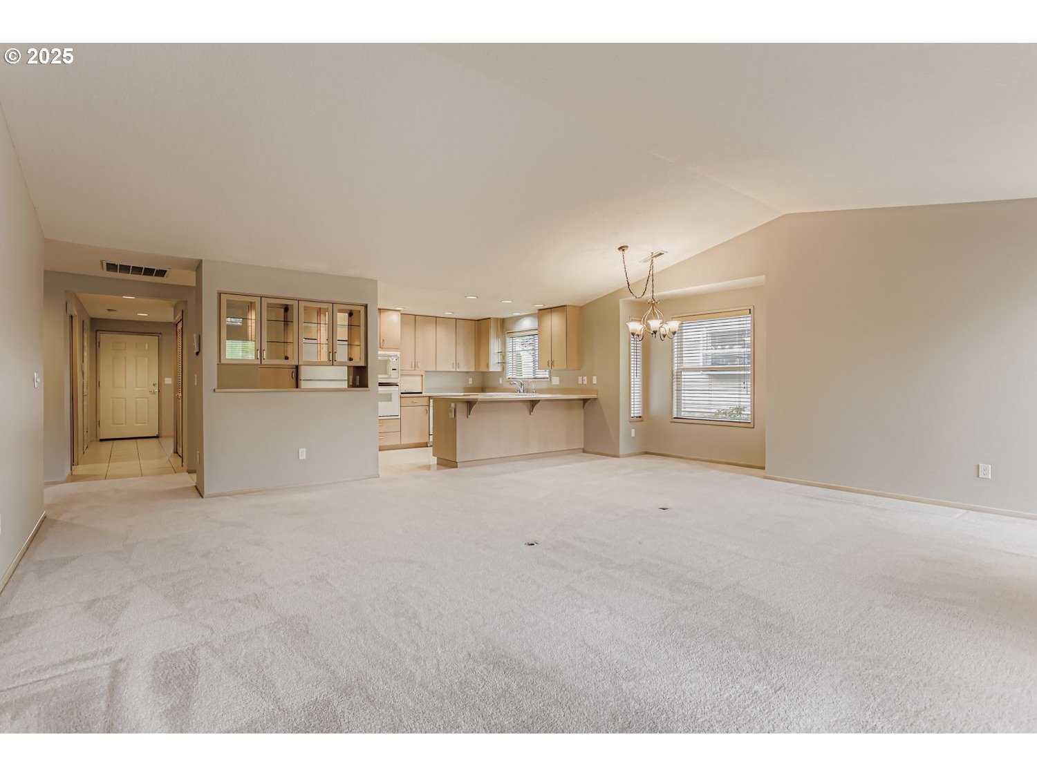 15917 Northeast Union Road, Unit 113 Ridgefield, WA 98642 - Photo 8 of 27 a view of empty room with kitchen and window