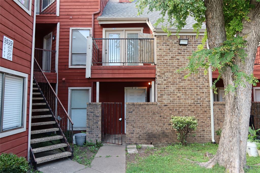 9839 Walnut Street, Unit T107 Dallas, TX 75243 - Photo 1 of 1 front view of a house with a yard