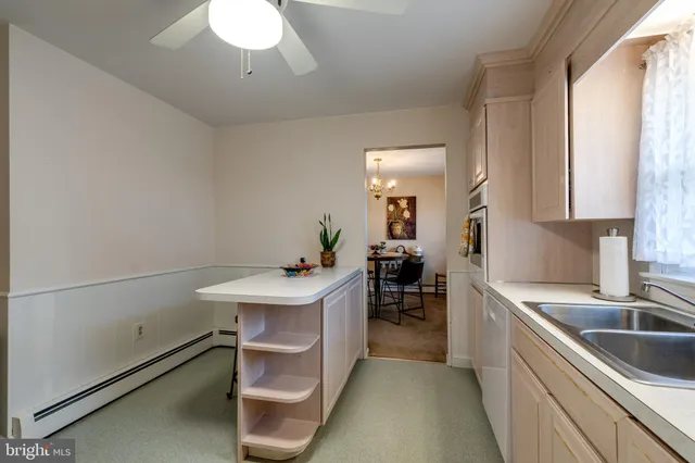 a kitchen with a sink cabinets and counter space