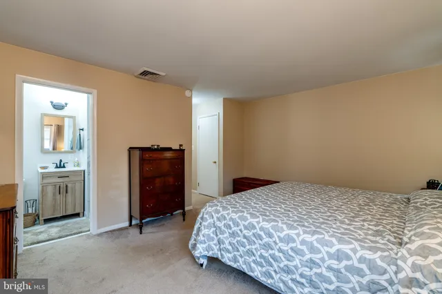 a bedroom with a bed and a stove top oven