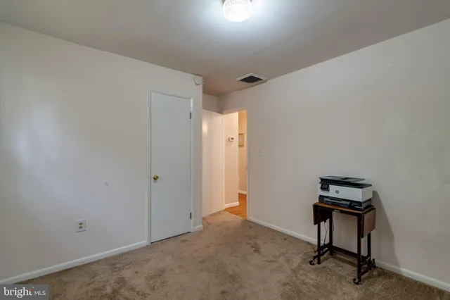 a view of a workspace with furniture