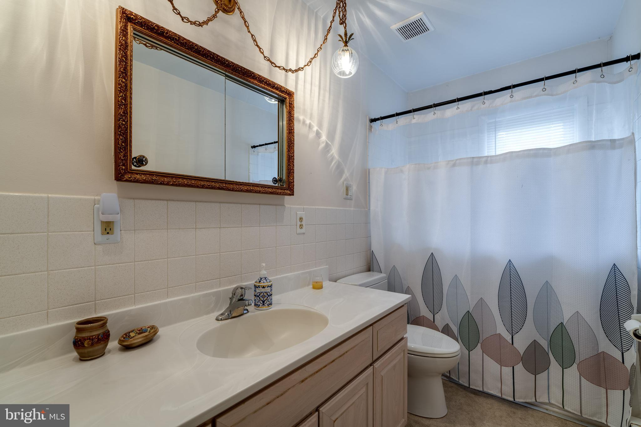 201 Cardinal Road Lititz, PA 17543 - Photo 33 of 50 a bathroom with a toilet sink and mirror