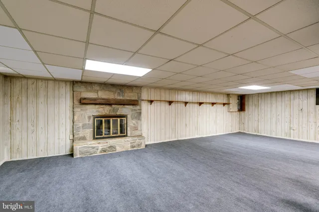 an empty room with a empty space and windows