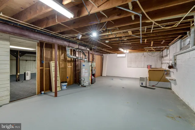 a view of empty room with wooden ceiling