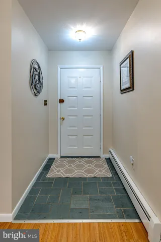 a view of a hallway with a door