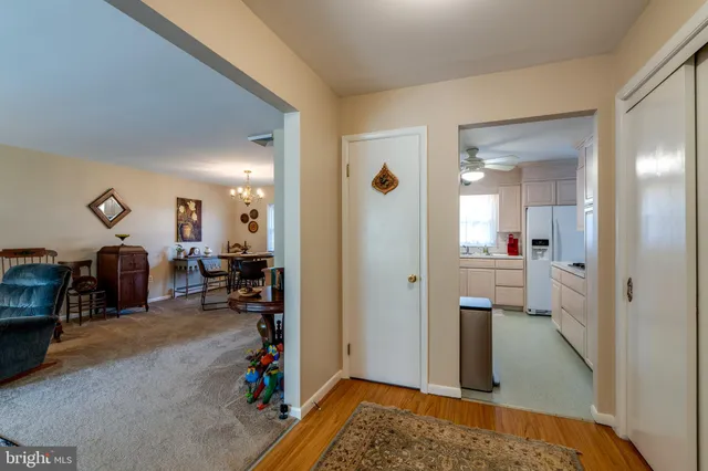 a view of a hallway with livingroom and living room