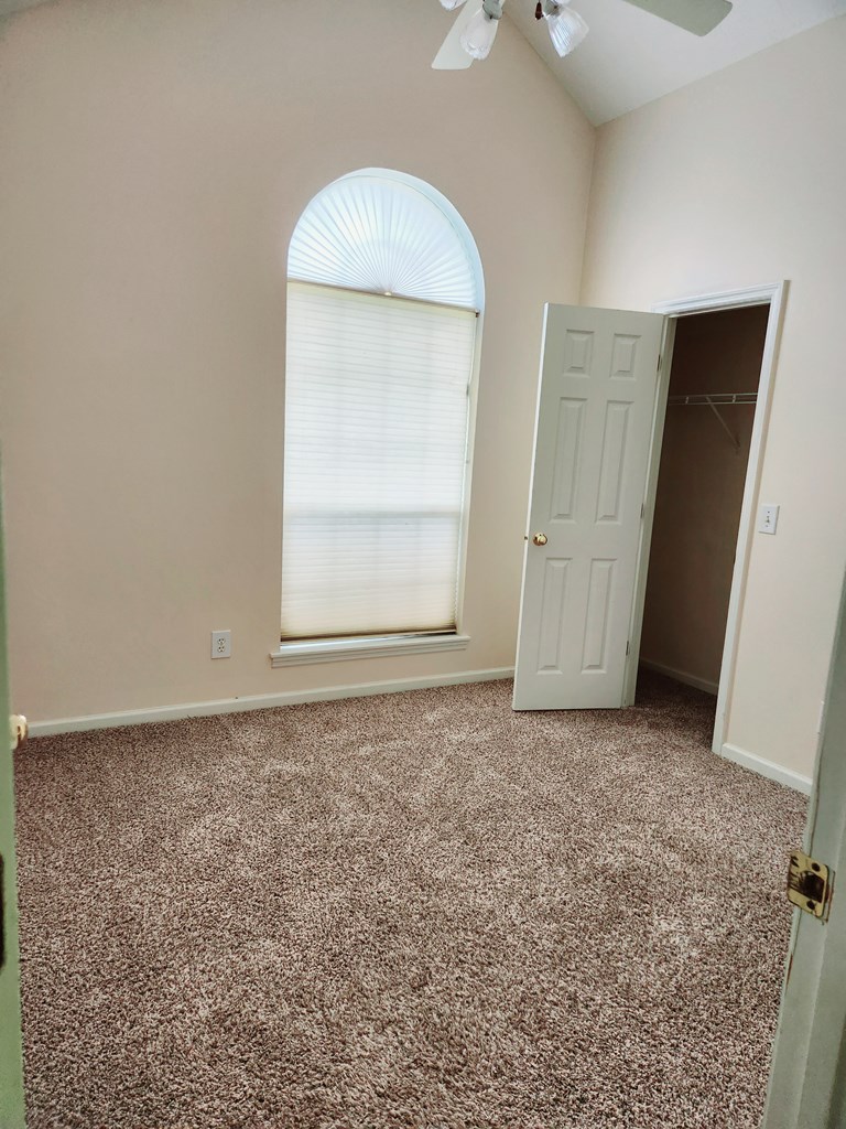 7312 Cedar Creek Loop Columbus, GA 31904 - Photo 14 of 17 an empty room with cabinet and a mirror