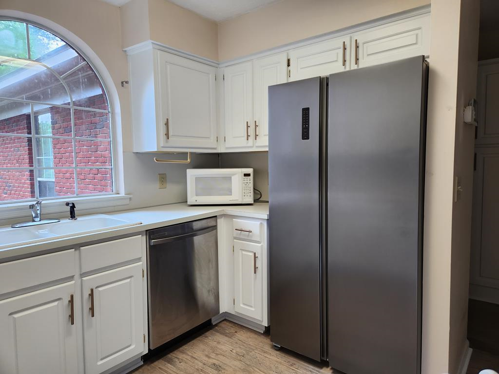 7312 Cedar Creek Loop Columbus, GA 31904 - Photo 7 of 17 a kitchen with a refrigerator and sink