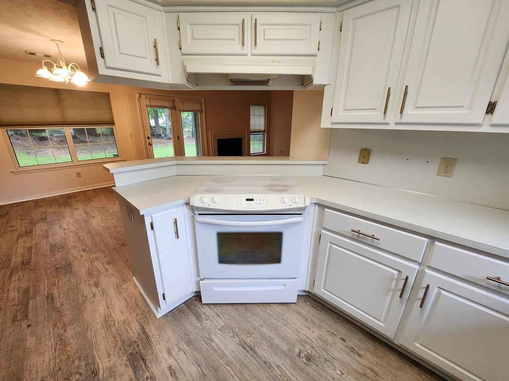 7312 Cedar Creek Loop Columbus, GA 31904 - Photo 8 of 17 a kitchen with granite countertop white cabinets and white appliances