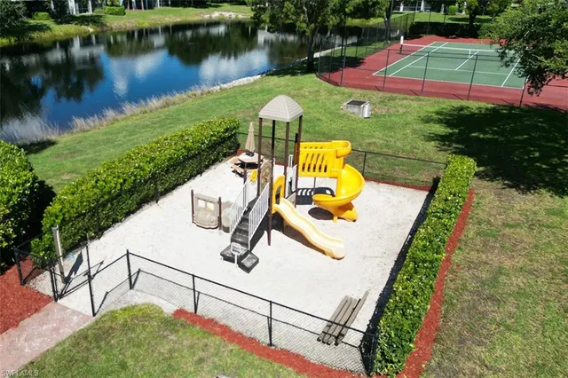 swimming pool view with a lake view