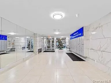 a view of a room with gym equipment and a large window