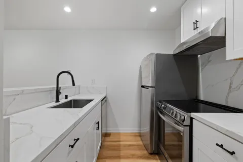 a kitchen with a sink and cabinets
