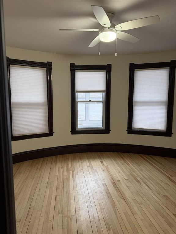 53 Barclay Street, Unit 1 Worcester, MA 01604 - Photo 12 of 17 a view of an empty room with wooden floor and a window
