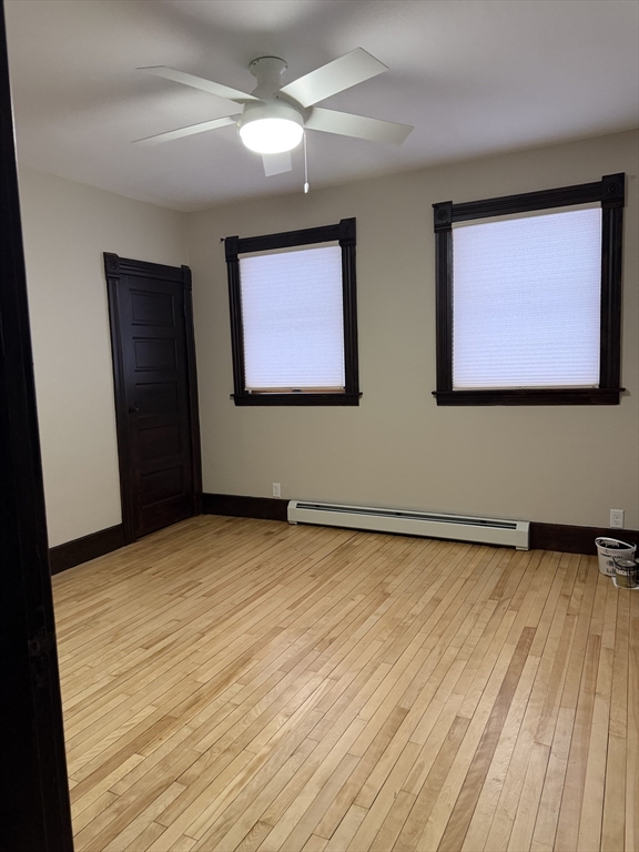 53 Barclay Street, Unit 1 Worcester, MA 01604 - Photo 14 of 17 a view of an empty room with wooden floor
