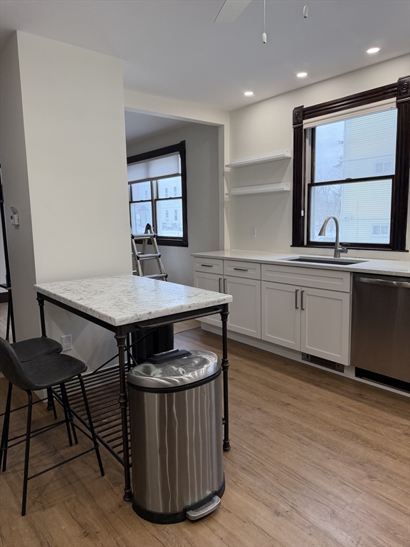 53 Barclay Street, Unit 1 Worcester, MA 01604 - Photo 6 of 17 a kitchen with a wooden floor and breakfast area