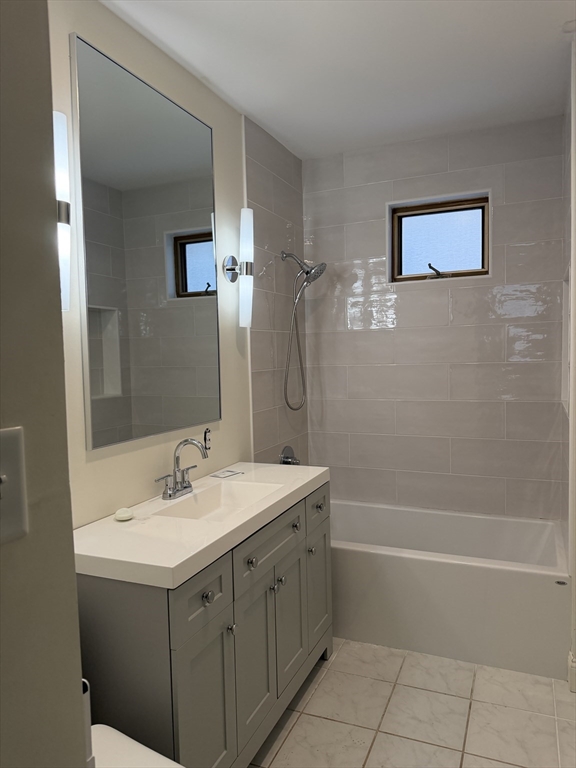 53 Barclay Street, Unit 1 Worcester, MA 01604 - Photo 7 of 17 a bathroom with a sink mirror toilet and bathtub