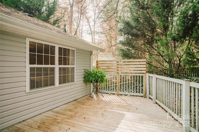 a bed room with a bed and a chandelier
