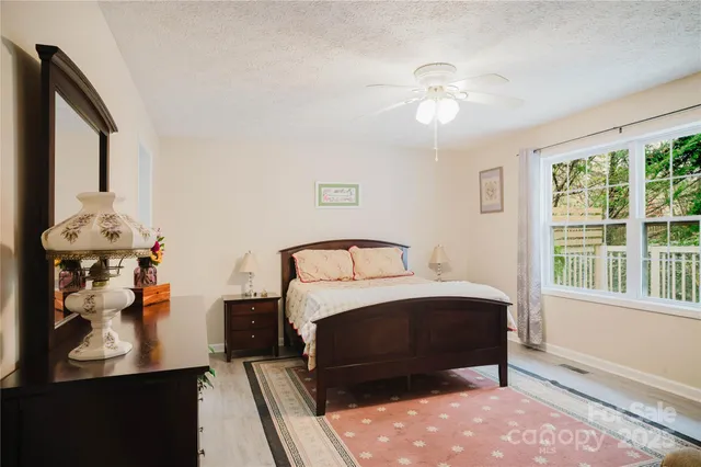 a view of a room with wooden floor and closet
