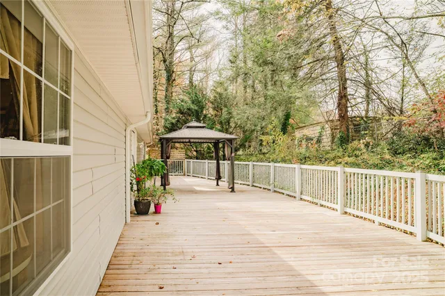a bedroom with a large bed and a dresser