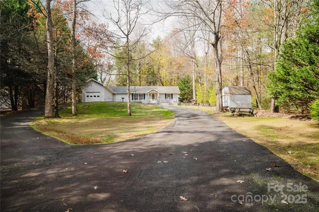 $425,000 | 107 Sugar Mill Woods Drive, Zirconia, NC 28790