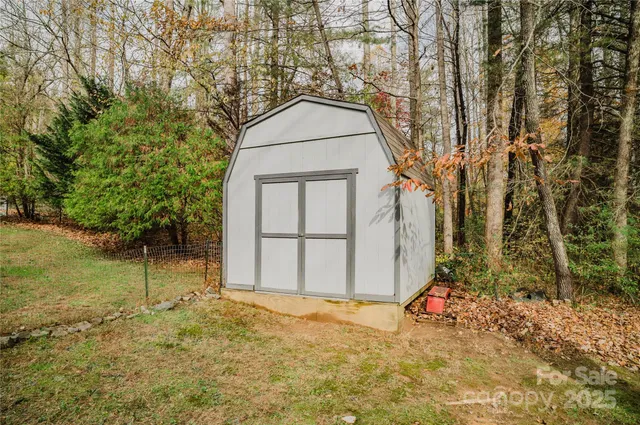 $425,000 | 107 Sugar Mill Woods Drive, Zirconia, NC 28790