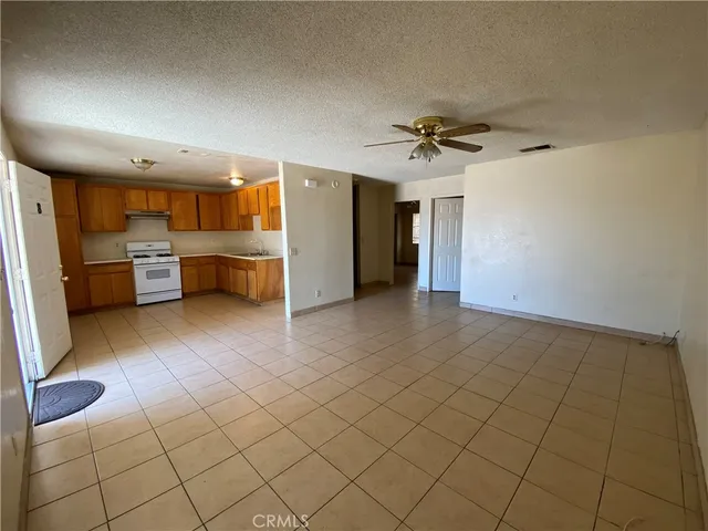 a view of a kitchen with furniture and a stove