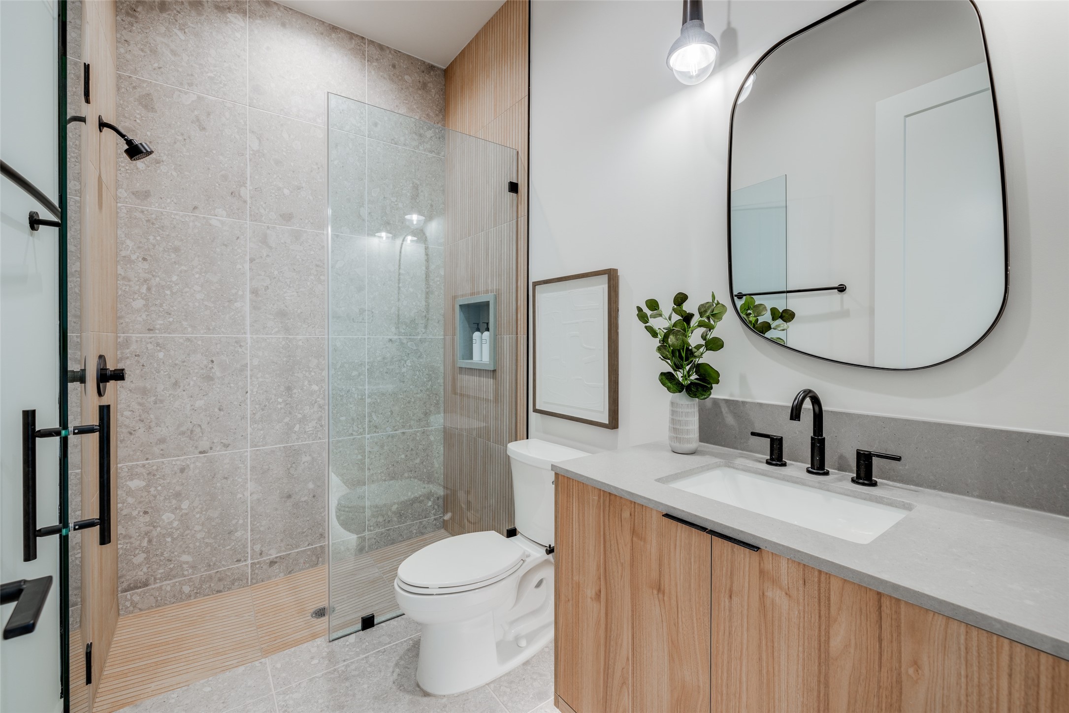 1701 Banks Street Houston, TX 77098 - Photo 32 of 50 a bathroom with a sink a toilet and a mirror