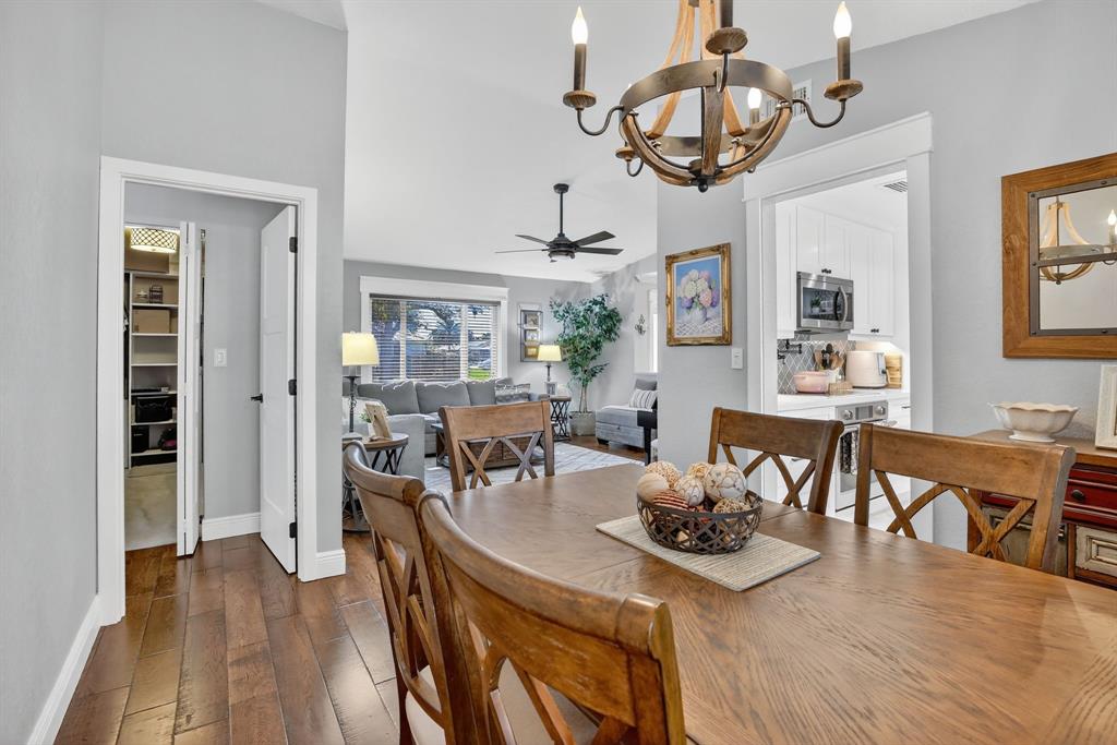 11611 Southwest 52nd Street Cooper City, FL 33330 - Photo 11 of 45 a view of a dining room with furniture wooden floor and chandelier